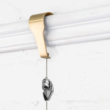Load image into Gallery viewer, Picture Rail Molding Hook Art Hangers, Gallery Quality, Instantly Adjustable: Choose Brushed Brass or Stainless Steel Hangers with 6.5-Foot Cables (1, Brass)