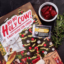 Load image into Gallery viewer, Man Crates Jerky Advent Calendar 2024 Featuring &quot;Ho-Ho-Holy Cow&quot; Artwork – Includes 25 Delicious Bites of Beef Jerky – Delicious Flavors Like Orange Habanero, Rootbeer and More